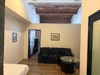 The room could be an apartment it is that well planned.