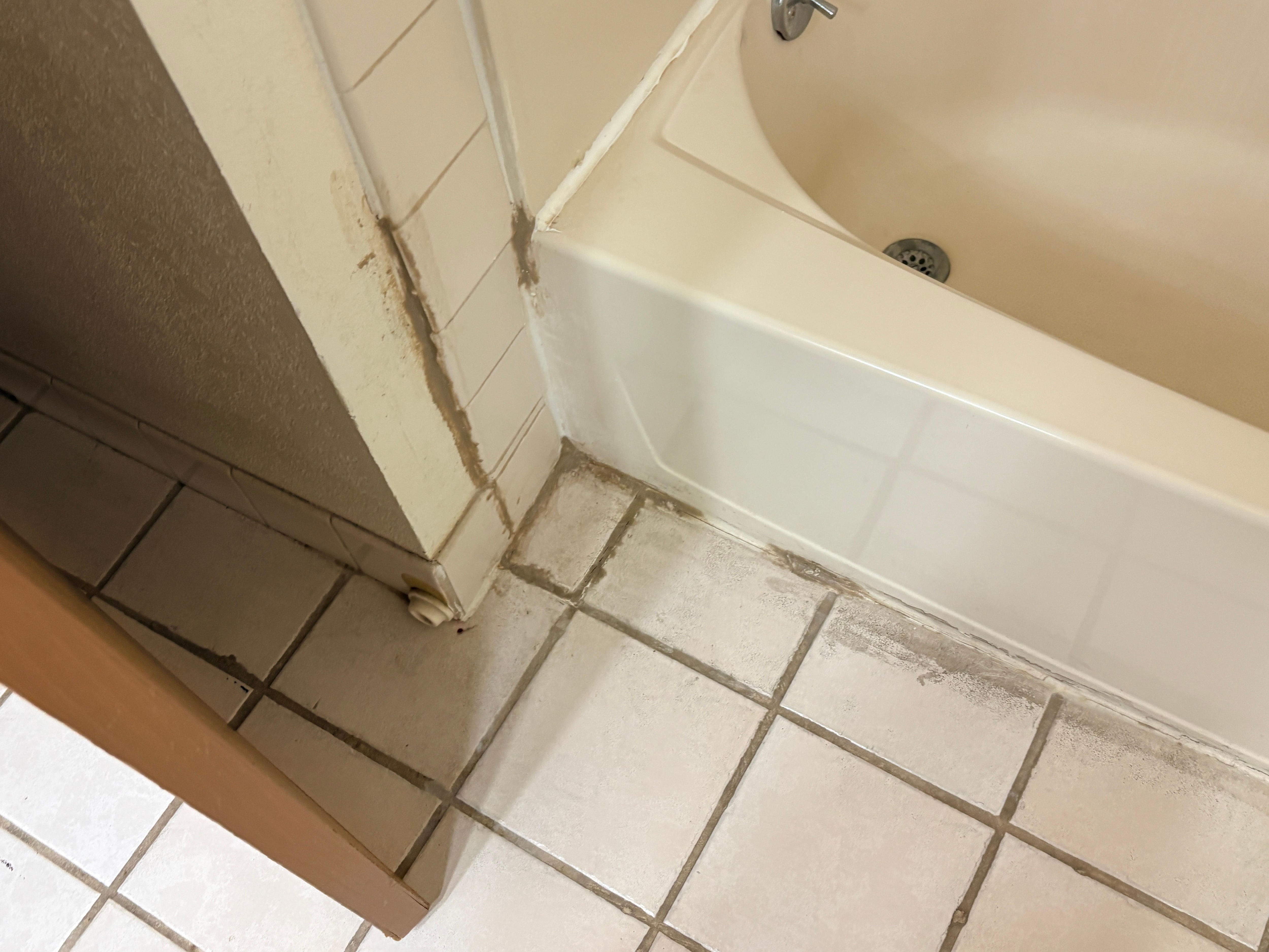 Some kind of grout repair, like a child did it.  