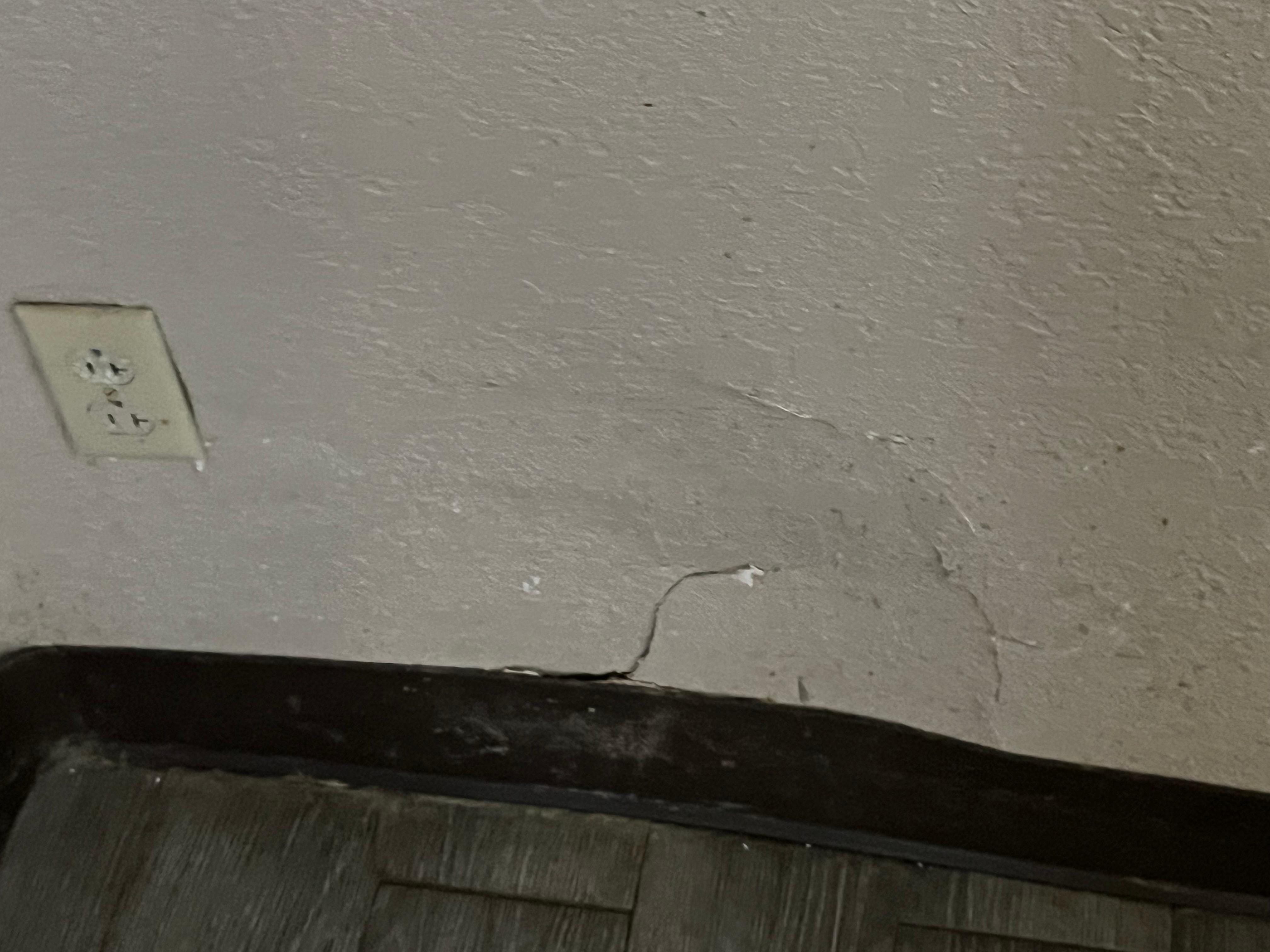 Hole in wall by bathroom 