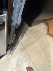 Taped up dishwasher.