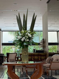 Libby with fresh flowers facing the lovely dinning & breakfast area.