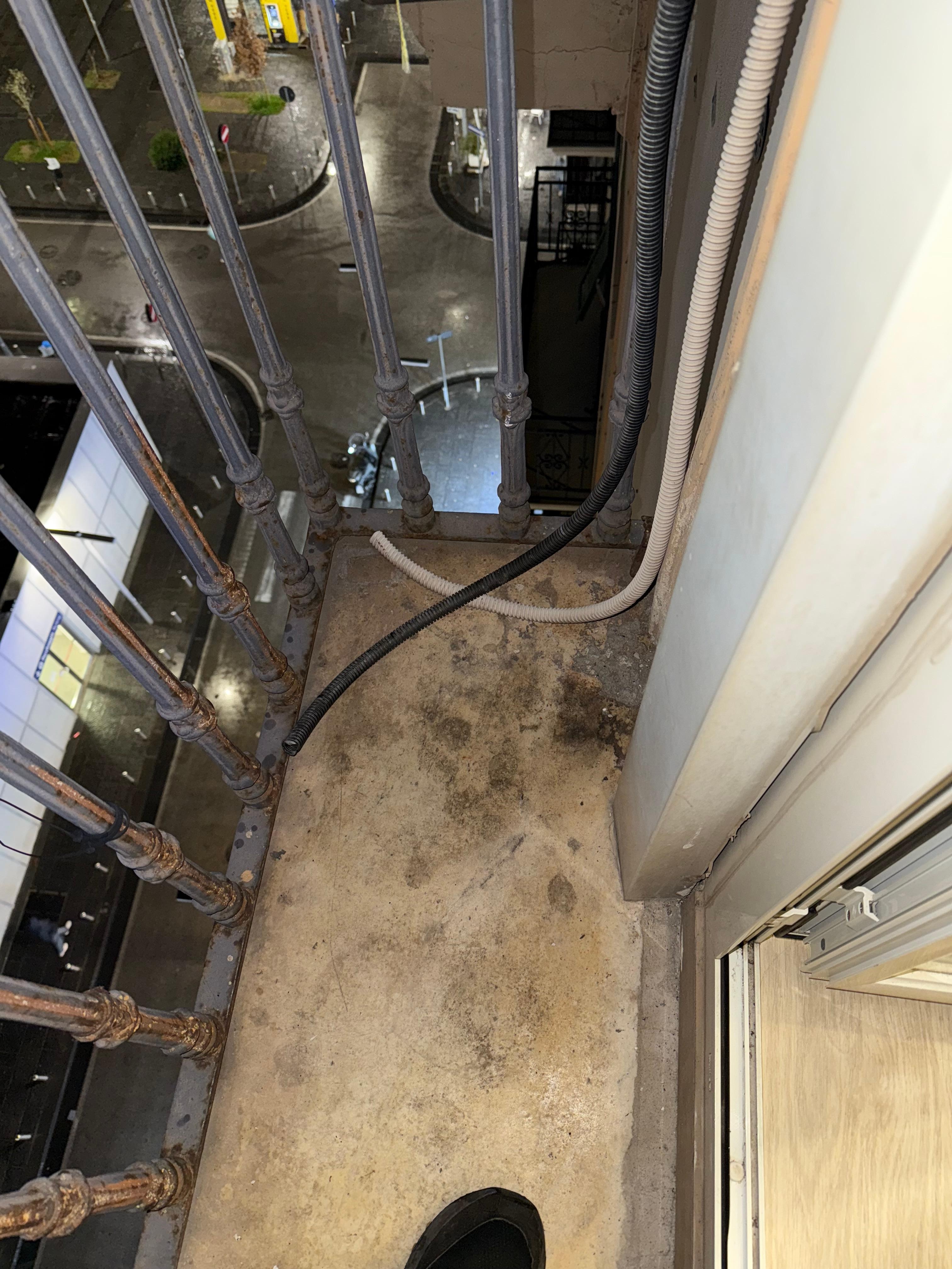 Balcony dirty and eire exposed