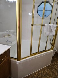 Really outdated bathroom compared to one listed online. Window unit in bedroom.