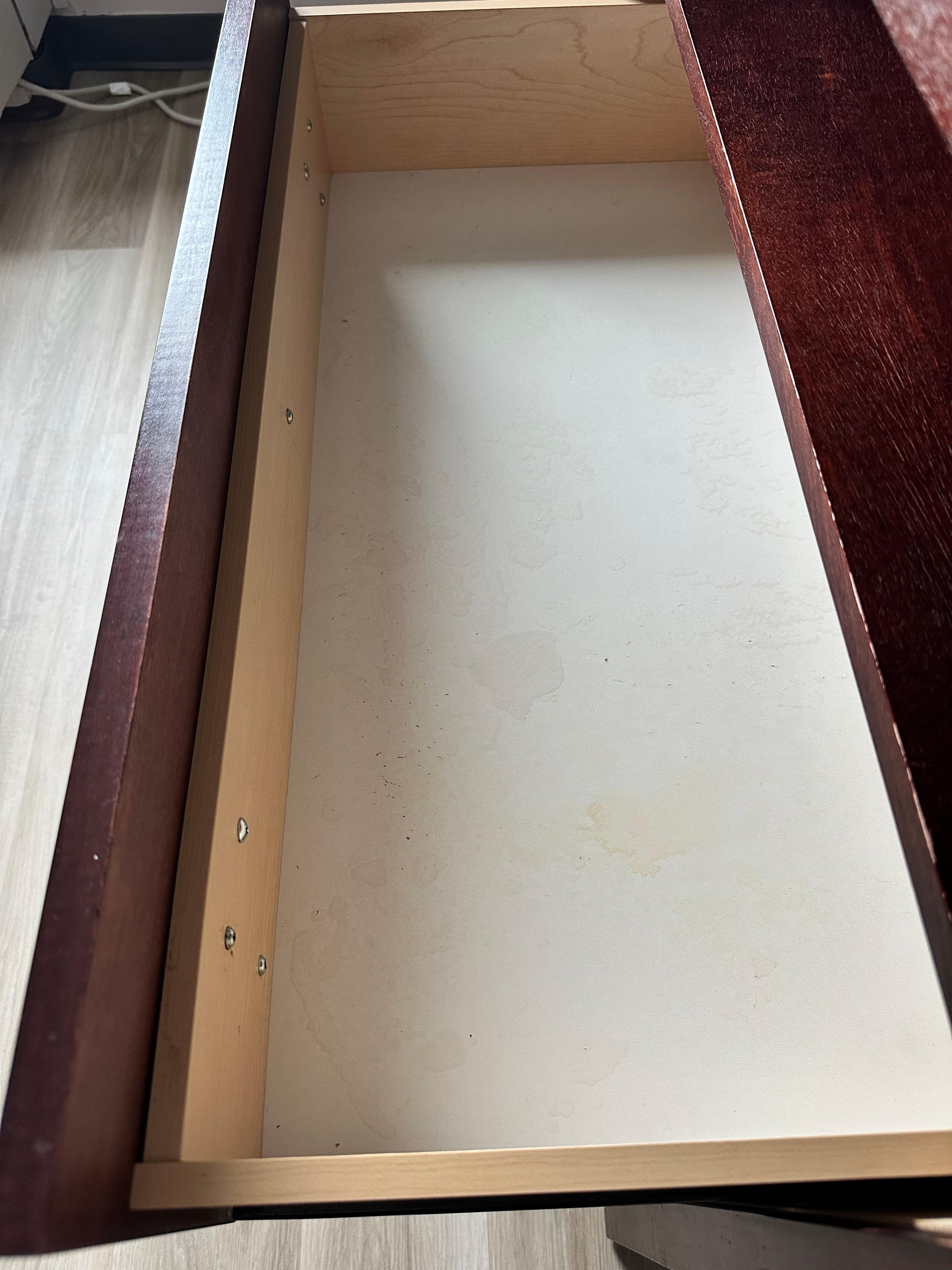 It's not hard to recover the botton of a drawer so it looks safe to put things inside ...