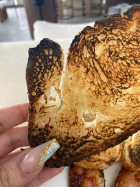 The only option covered by the voucher was the “classic breakfast,” which consisted of undercooked scrambled eggs with parsley, thick burnt bacon that was both limp and overcooked, and burnt toast. The same plate was priced at $20