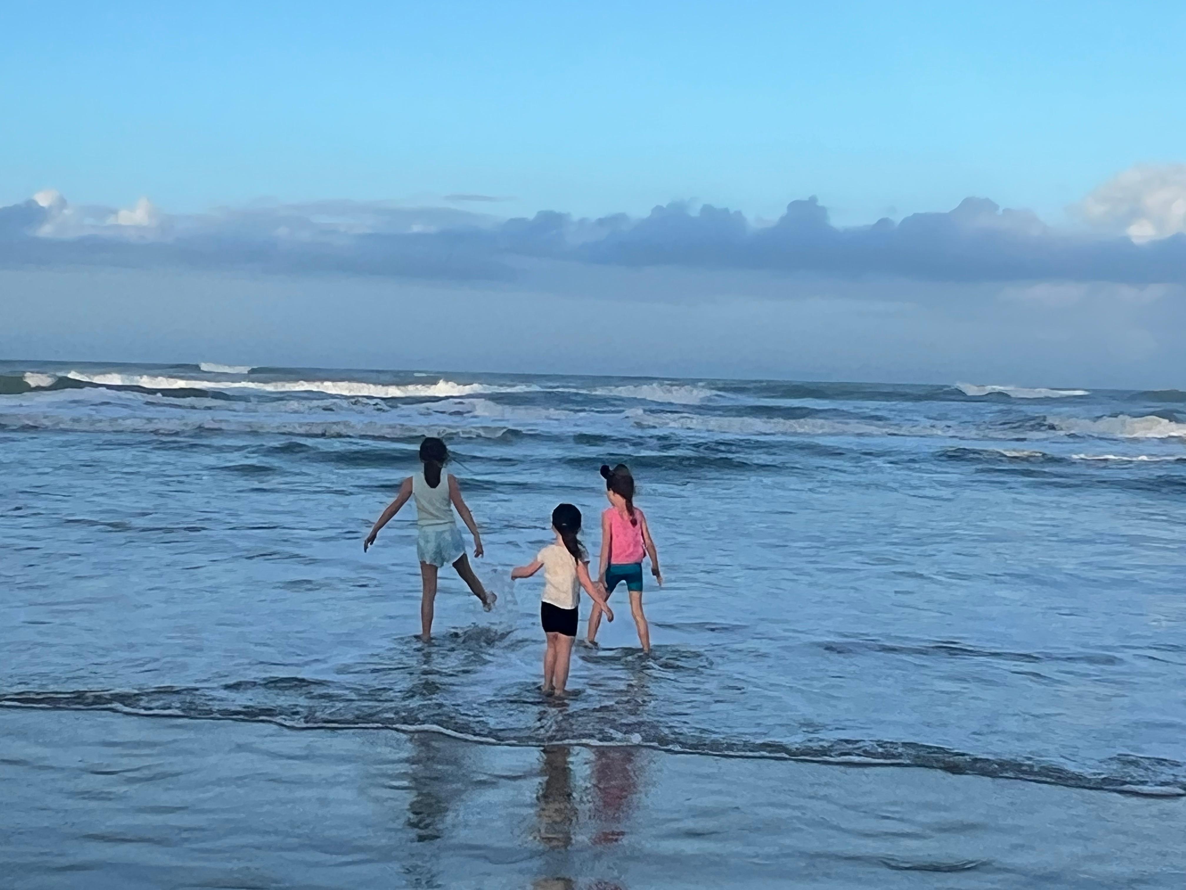 Grandkids loving the ocean.