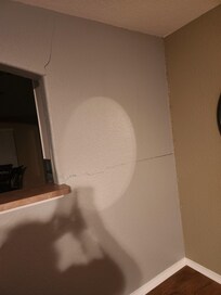 Crack on the wall in the living room.