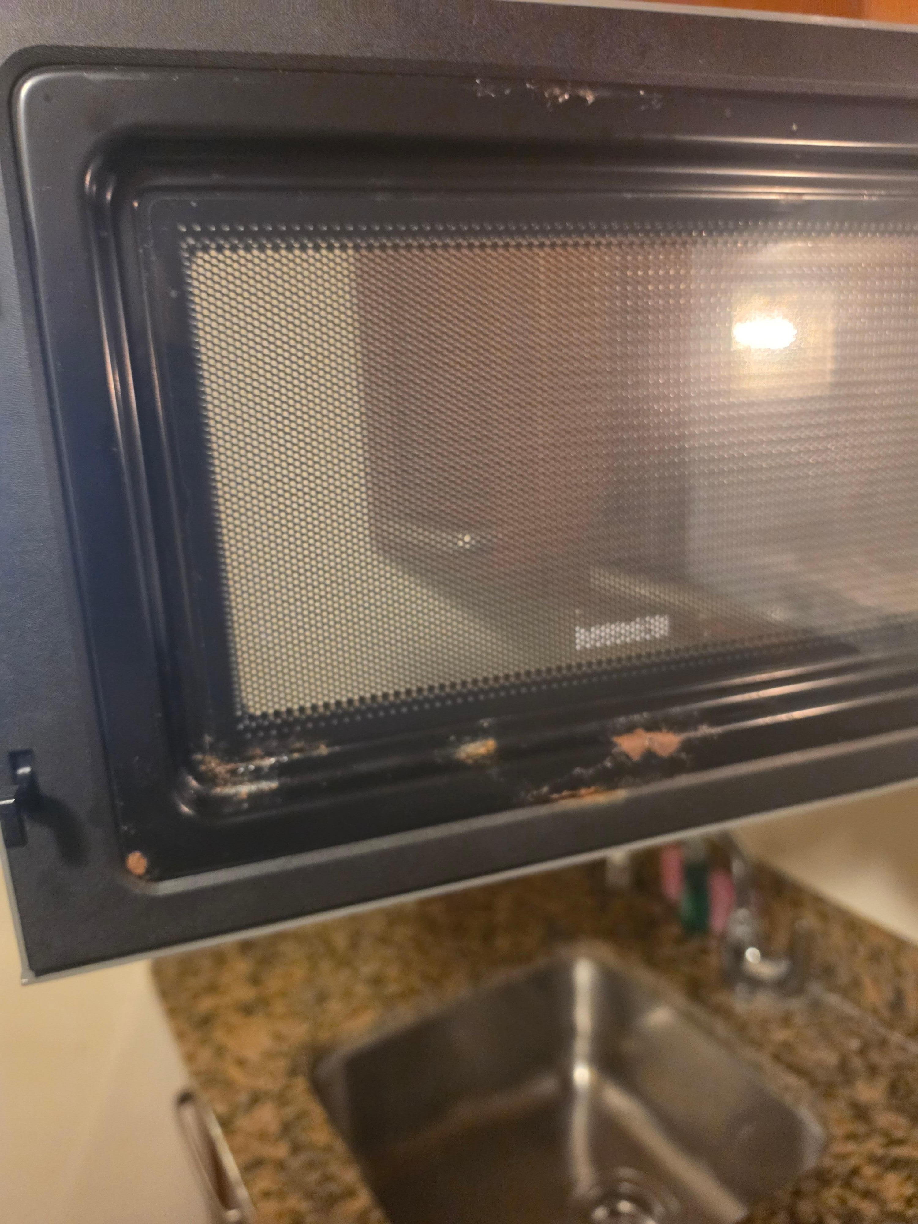 Outdated rusty dirty microwave 
