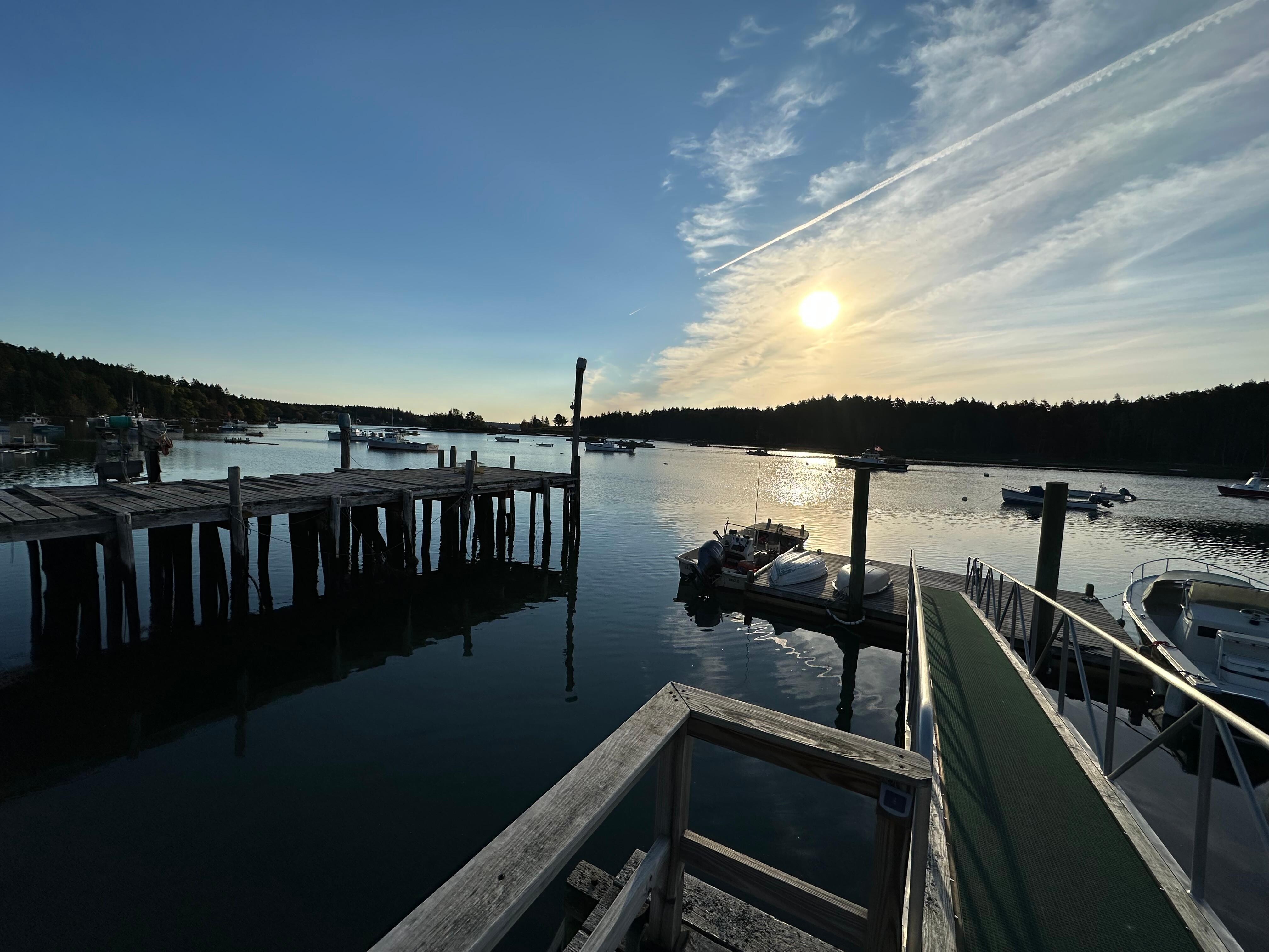 Morning sun over the docks and water.