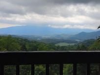 Relaxing by hot tub taking in scenery.