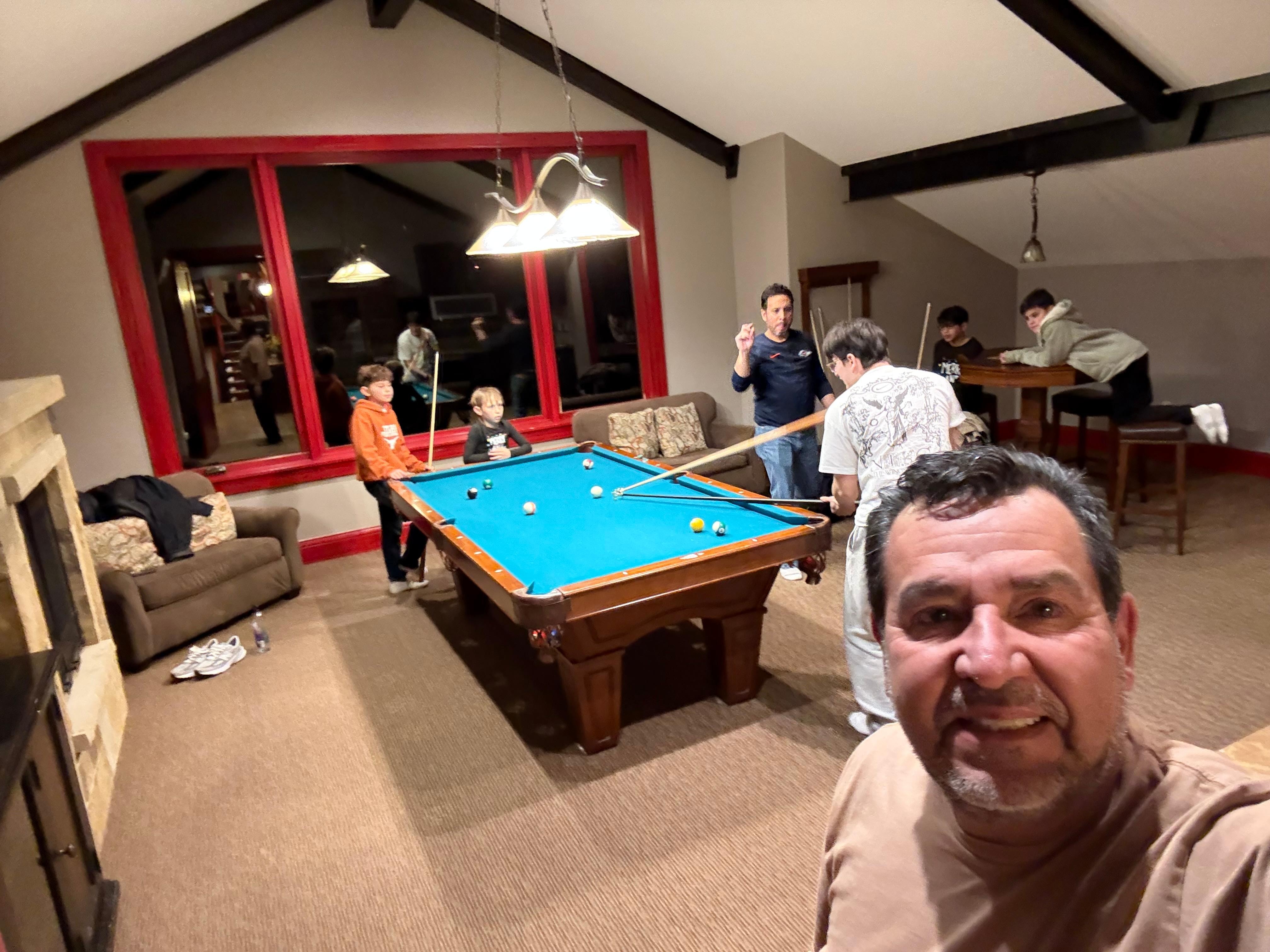 Kids having a bast in the game room