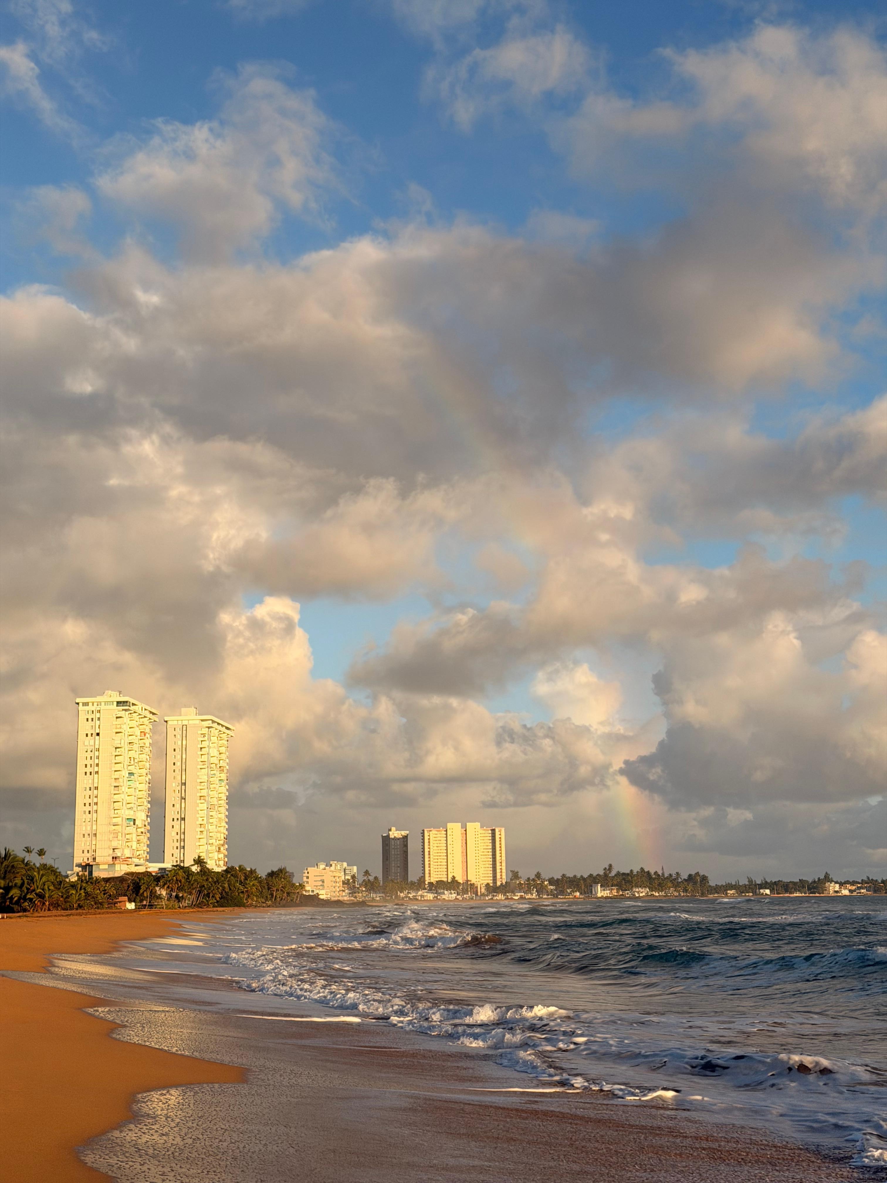 Rainbow with condos to the left