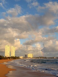 Rainbow with condos to the left