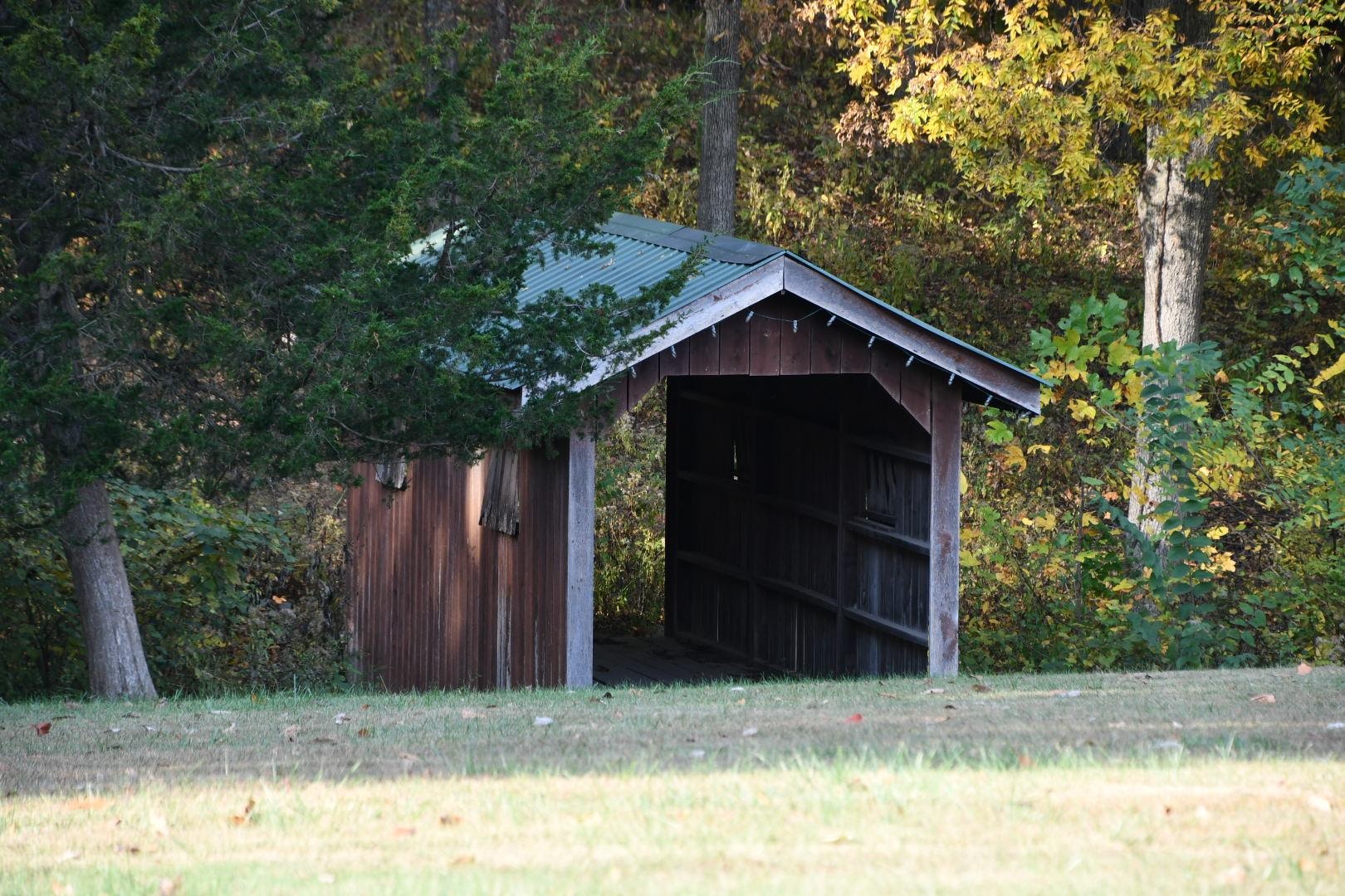 Cute covered bridge across the driveway 