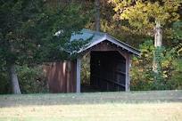 Cute covered bridge across the driveway
