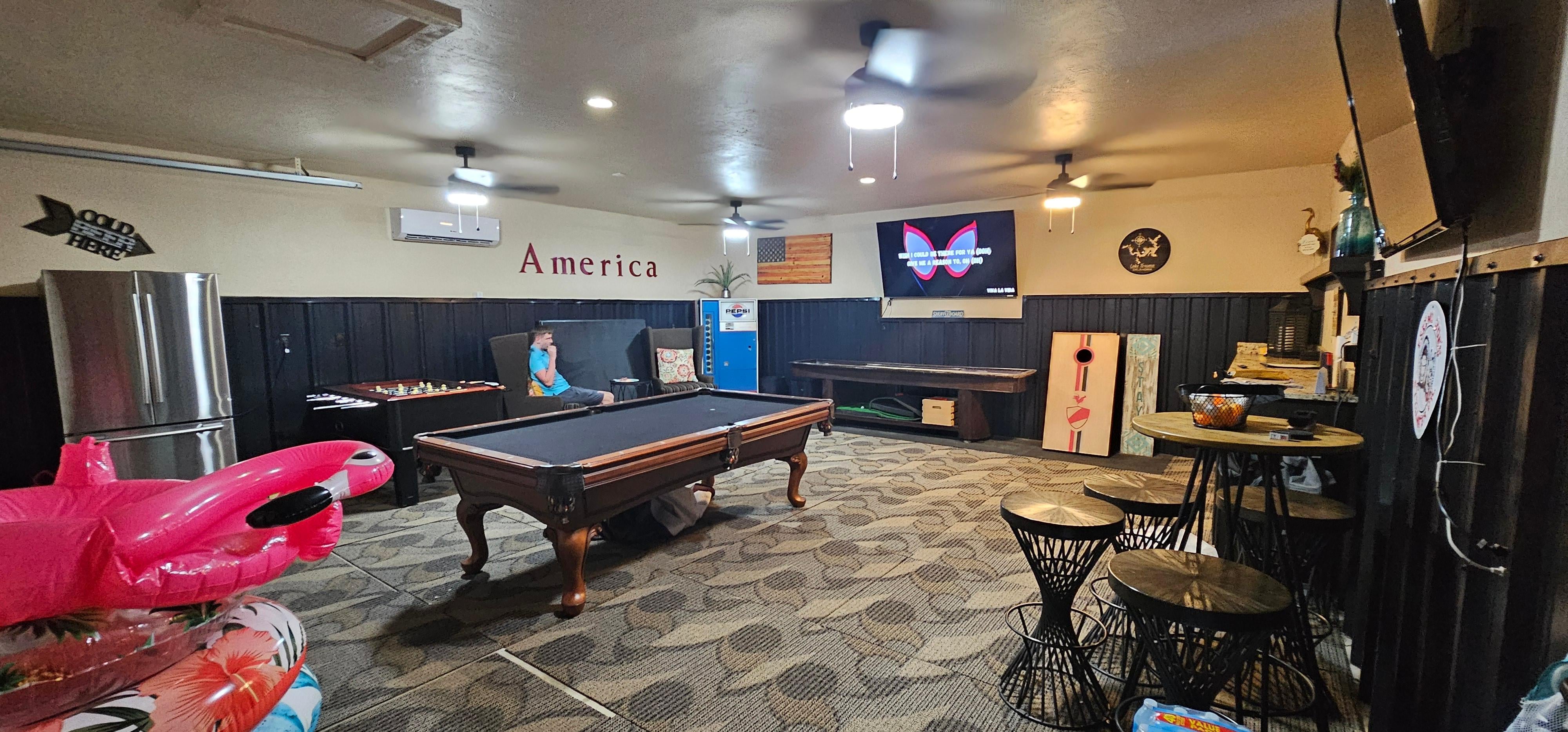Air-conditioned gameroom, with frig. and big screen tv.