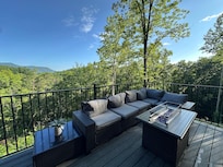 Outdoor conversational seating near the jetted hot tub/swim.