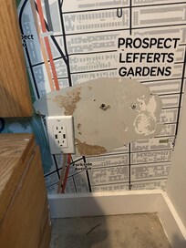 Holes in wall and inoperable power outlet