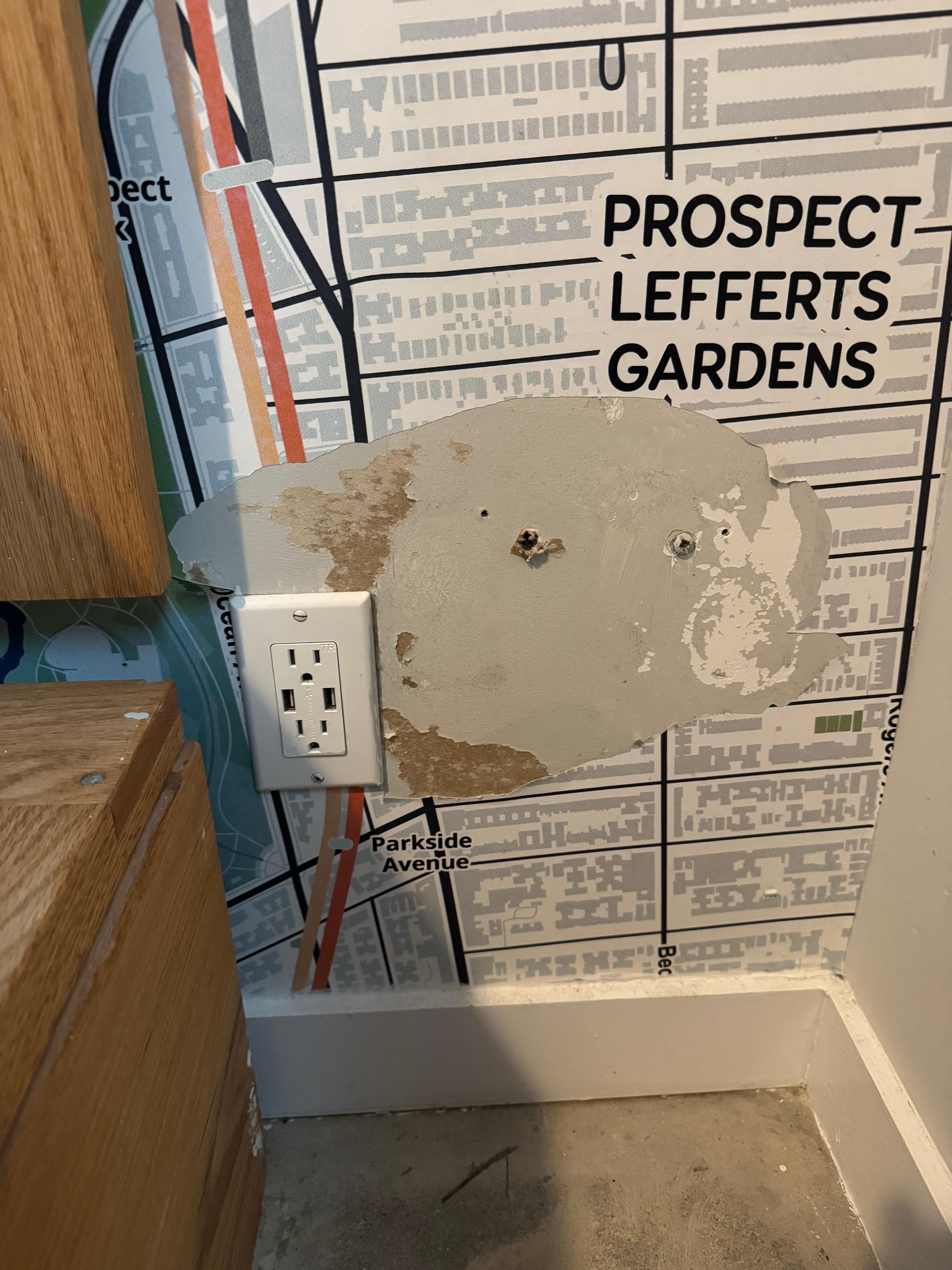 Holes in wall and inoperable power outlet 