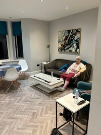 Mom resting on the couch.