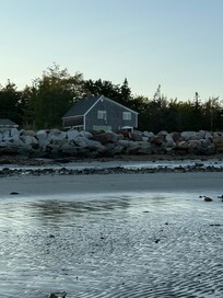 Sunset walk on the beach, the house is in the background.