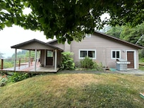View from the driveway toward the house