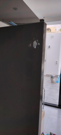 Lounge cupboard catch broken and stuck on with Blu Tac