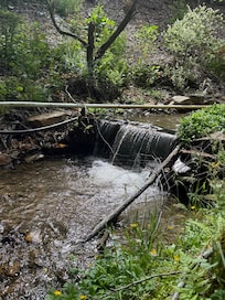 Small waterfall beside fire pit
