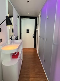 Sink across from the shower and toilet