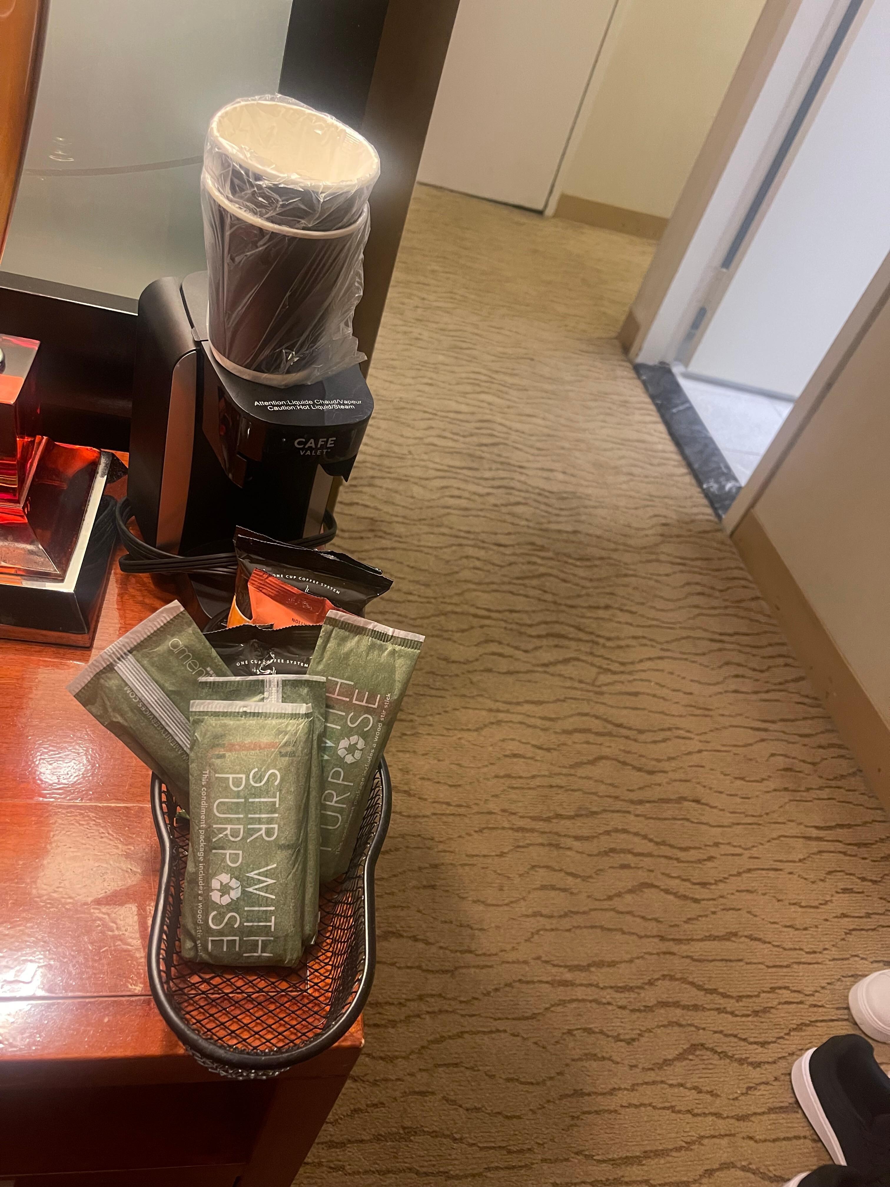 Asked for the coffee maker and they just left by the bed
