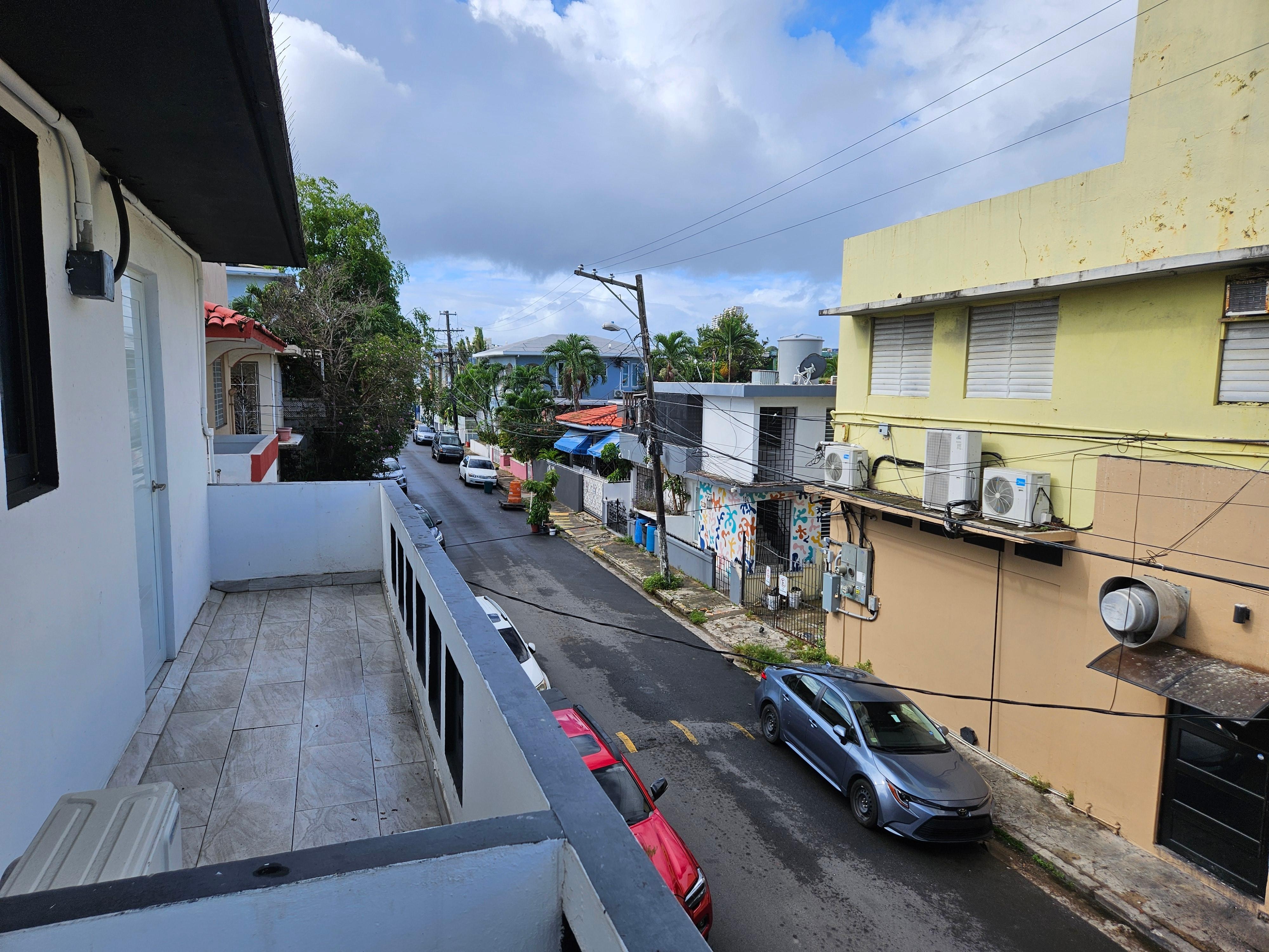 View outside kitchen window. Door opens to small balcony