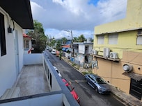 View outside kitchen window. Door opens to small balcony