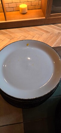 Food stuck on most plates, this one shoes dried on egg