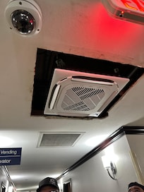 AC that is too small for the hole. They made no attempts to cover the gap.