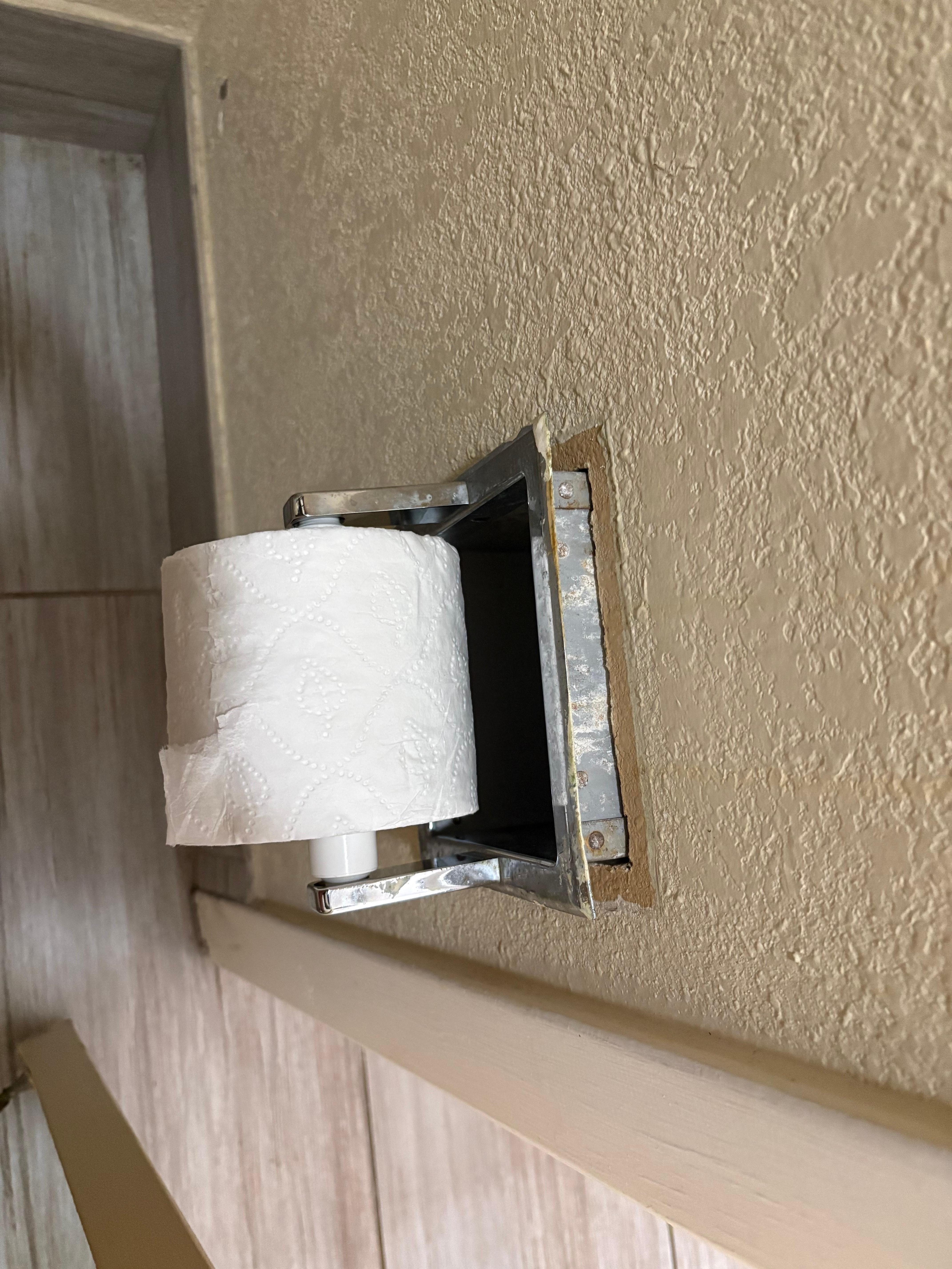 Broken toilet paper dispenser
