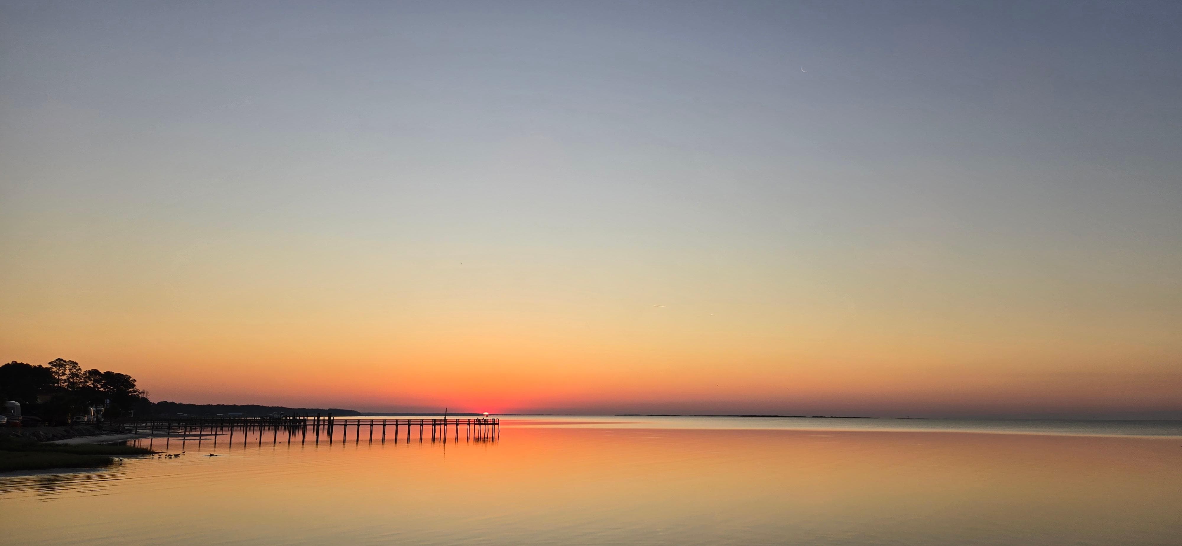 Sunrise on the beach in front of the home.