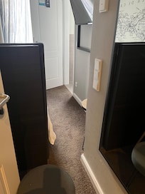 A 'tight squeeze' between the (single) bed and (dirty) wall.