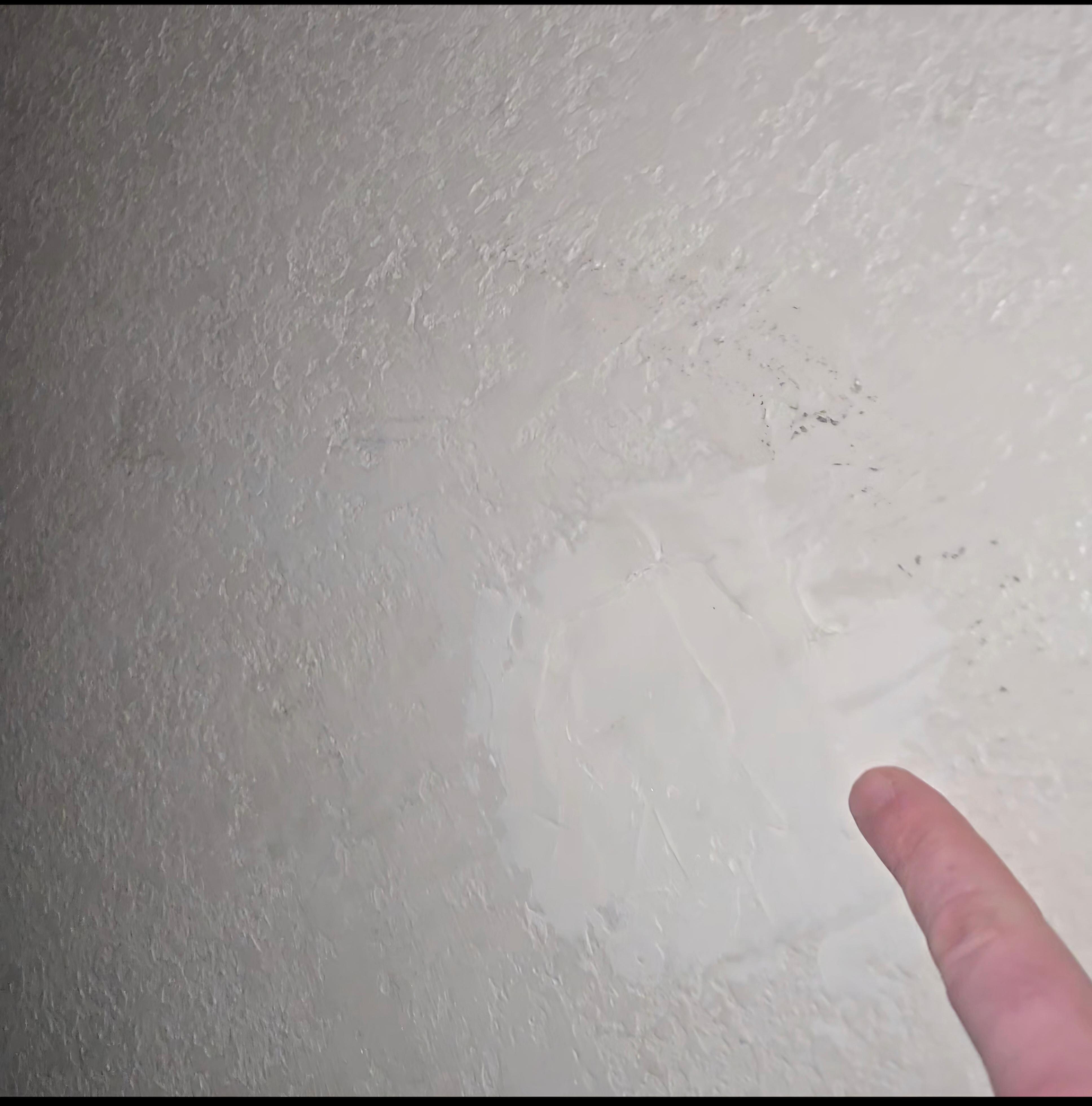 A random hole cheaply repaired. Right beside your bed for you to look at all night. 