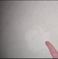 A random hole cheaply repaired. Right beside your bed for you to look at all night.