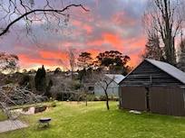 Sunrise view from one of the upstairs bedrooms looking over the (shared) backyard