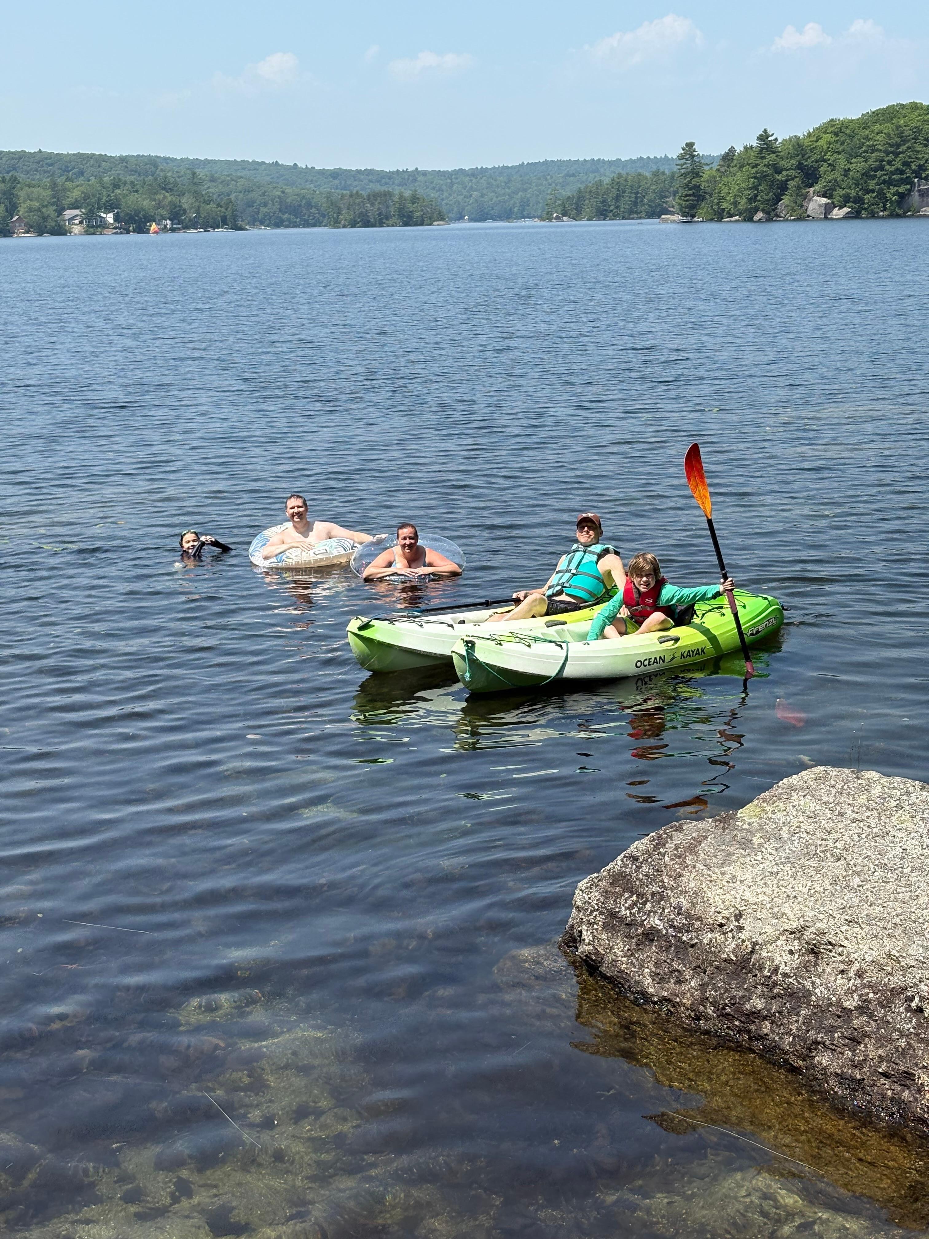 Family enjoying swimming and the kayaks on beautiful and peaceful Phillips Lake!