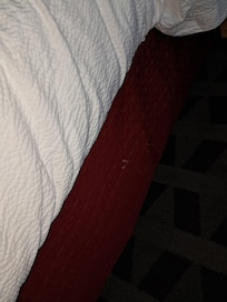 Hard to see from the angle the picture was taken, but looks like someone ejaculated and it ran down the side of the bed skirt