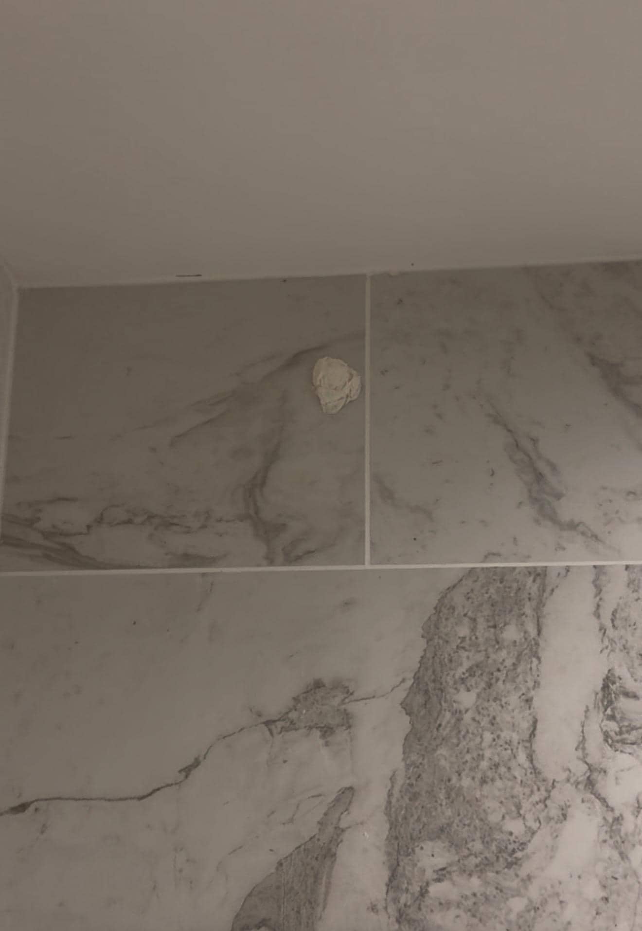 Disgusting paper wad ball on the top of the shower 
