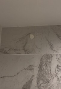 Disgusting paper wad ball on the top of the shower