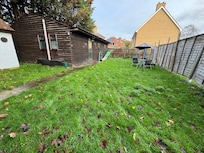 This is the ACTUAL place you are staying which looks like a shed BEHIND the house that is in the photos online.