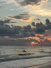 Sunsets are gorgeous. Plus every morning we watched dolphins swim by. Shelling was terrific, too. There are no lifeguards in this area. We did spot a stingray (or type of one) and did spot a đŠ up the a bit from the house.