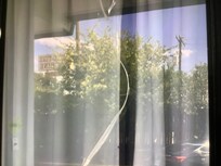 Cracked window fixed with packing tape.