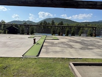 The outdoor games space (mini golf and tennis courts in background).