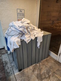 overflowing pool towel bin