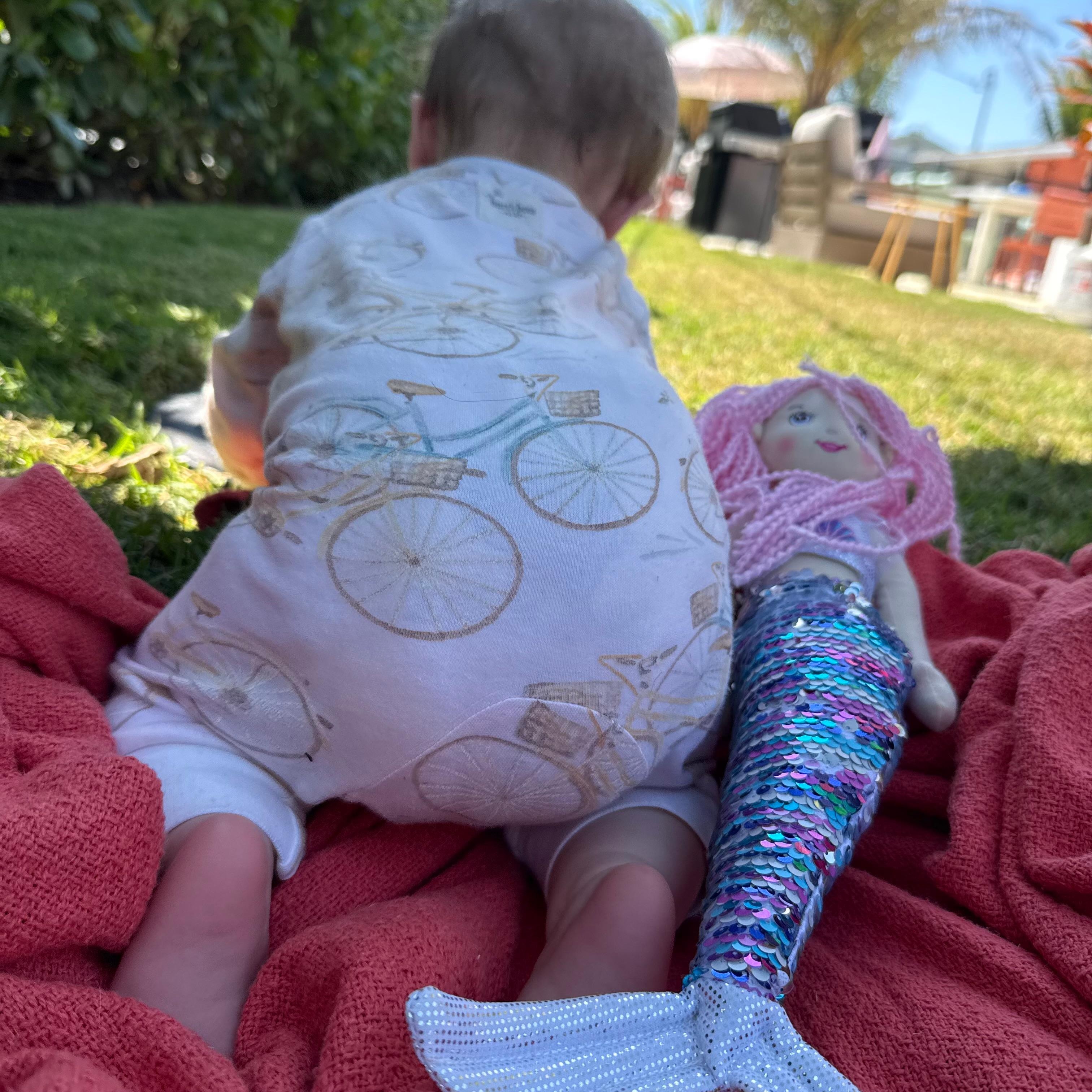 The grass was so soft, our grandbabies fell asleep in the cool shade. The property has a beautiful private hedge to make the backyard feel like a private oasis.